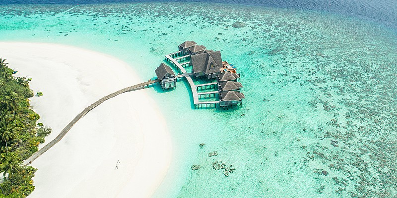 aerial view of some over water villas in the Maldives