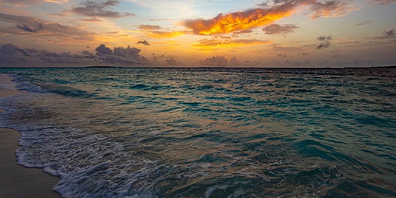 sunset from a beach in the Maldives