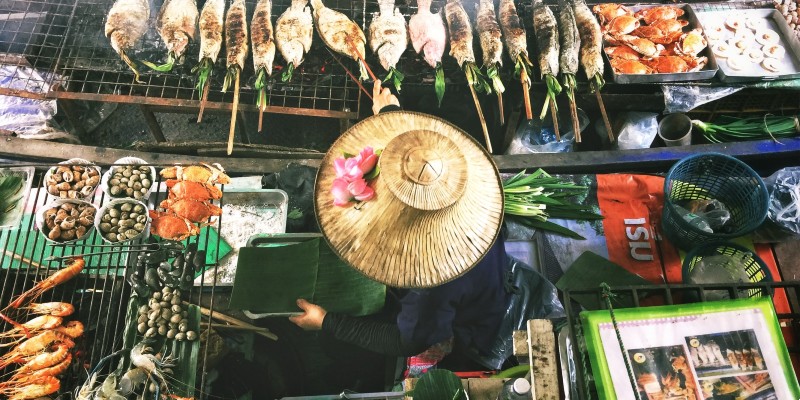 A woman in Thailand serves street food