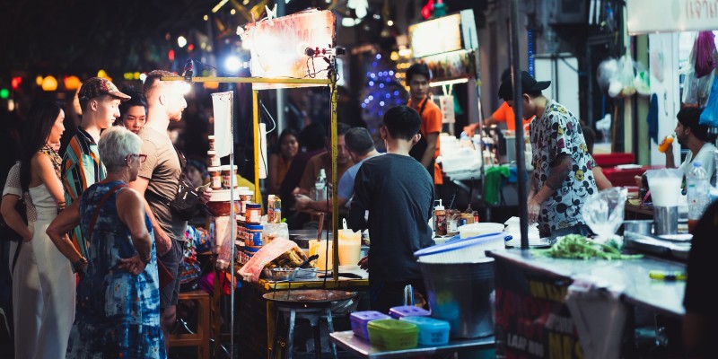 People at a night market in Thailand