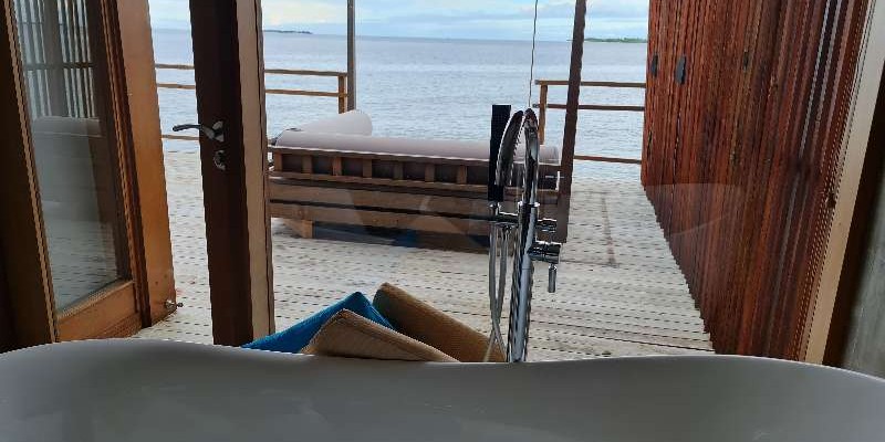 The view over the lagoon from your roll-top bath at at Furaveri Island Resort & Spa