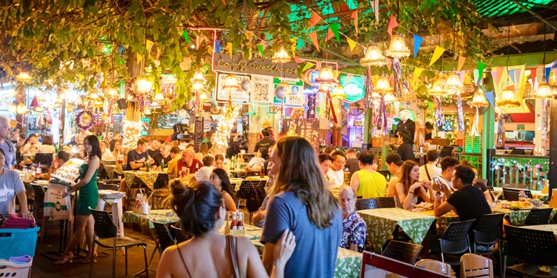 People eating in market area of Bangkok