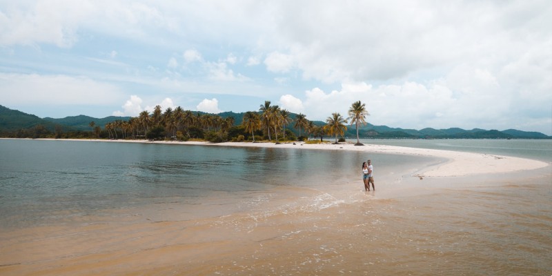 Two people on the beach at Koh Yao Yao island, Thailand