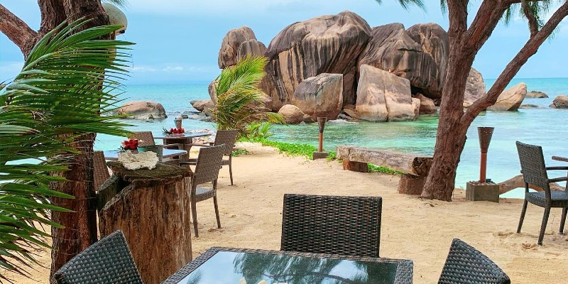 View from an outdoor table at Le Rochers restaurant in Praslin