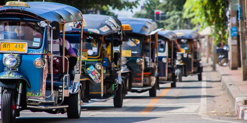 Tuk-tuks line the street in Thailand