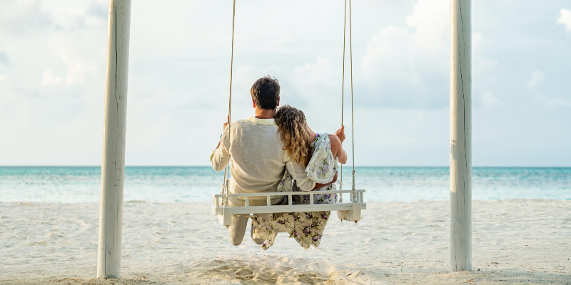 Couple on a swing in the Maldives