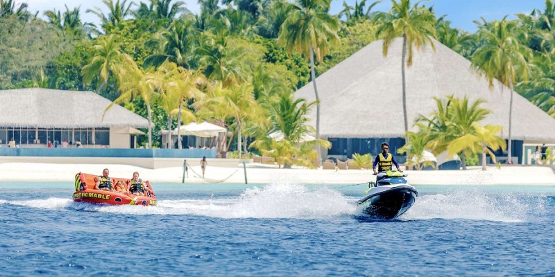 Couple doing water sports at Kihaa Maldives