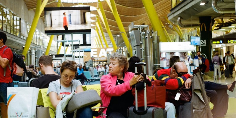 People waiting for flights in an airport