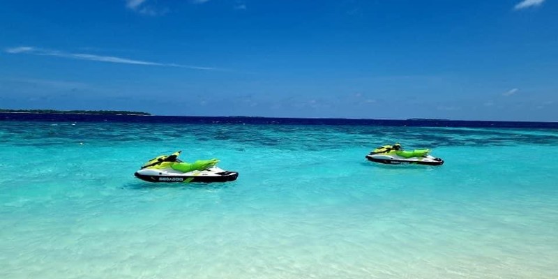 Jet skis bobbing in the turquoise water