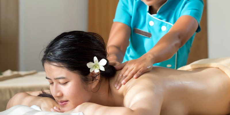 Woman getting a massage in the sun spa