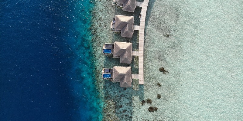 Aerial shot of the water villas at Cocogiri Island Resort