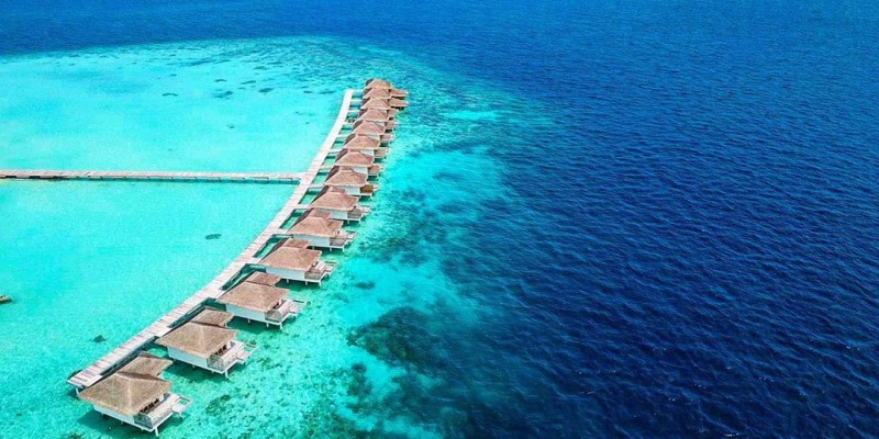 Aerial shot of water villas at Cocogiri Island Resort