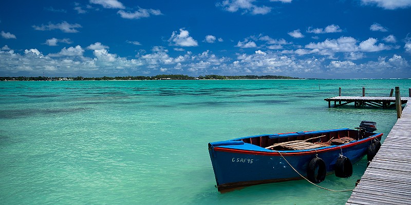 A boat tied to a jetty in Mauritius