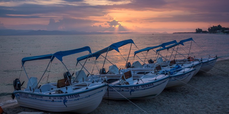 Boats moored on the sand