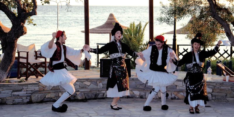 People doing a traditional Greek dance