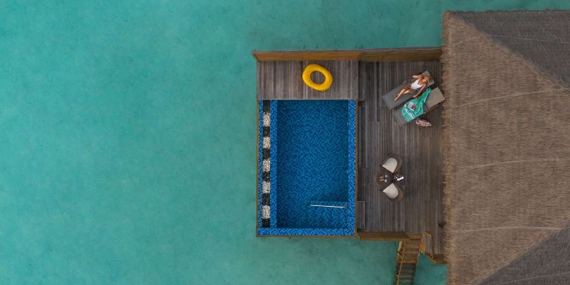 Aerial shot of a lagoon villa with pool