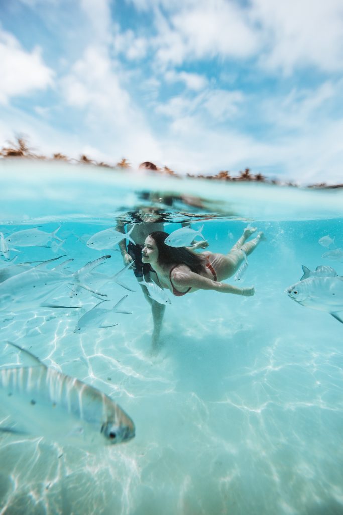 Woman swimming in clear ocean waters