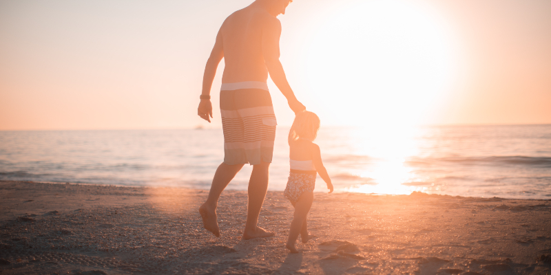 Father and daughter at the beach.