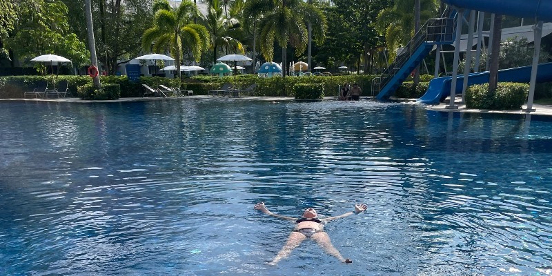 Woman floating in the resort pools