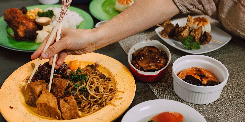 Person eating with chopsticks