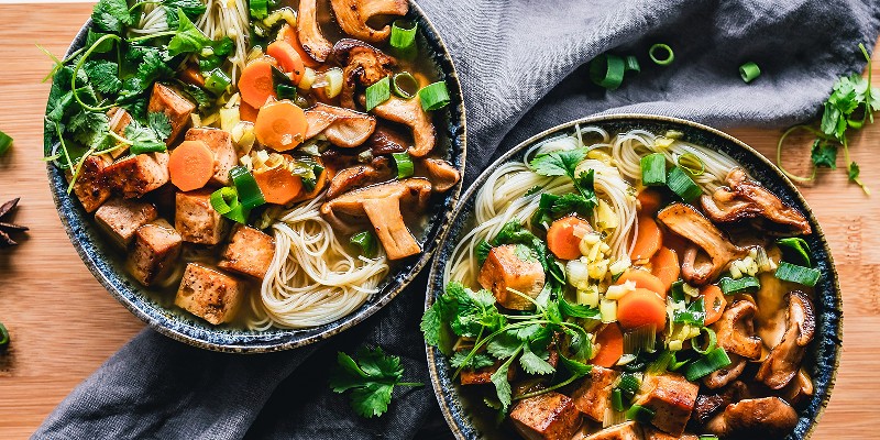 Two bowls of freshly made Thai food 