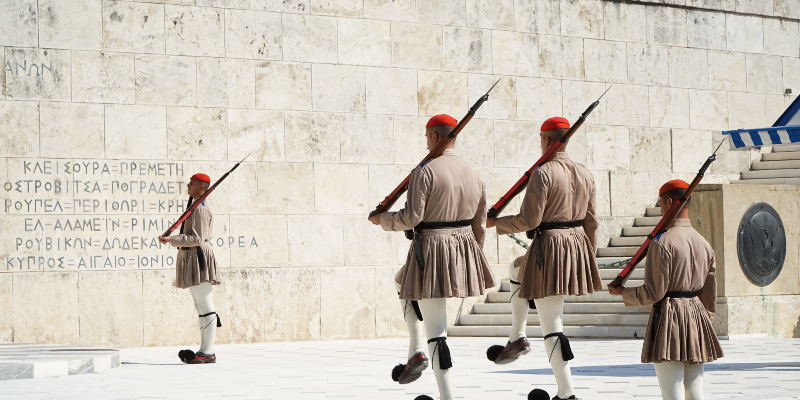 The guards in their traditional outfits.  Photo by Ola Kucha on Unsplash    