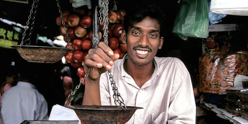 Shopkeeper in Sri Lanka smiling at the camera