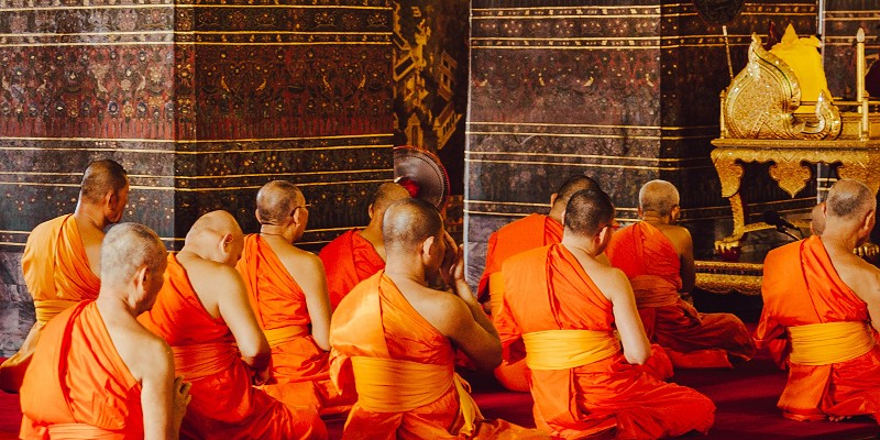 Buddhist monks praying in a Sri Lankan temple