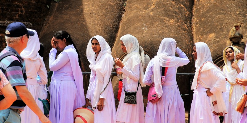 Women waiting to visit a temple in Sri Lanka