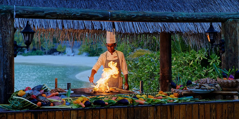 Chef cooking on an exterior grill
