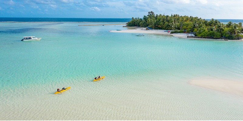 People kayaking in the Rihiveli Maldives lagoon