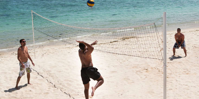 Join the action with a fast-paced game of beach volleyball